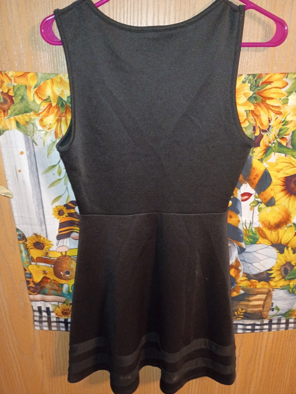 A Black Sleeveless Fitted Dress